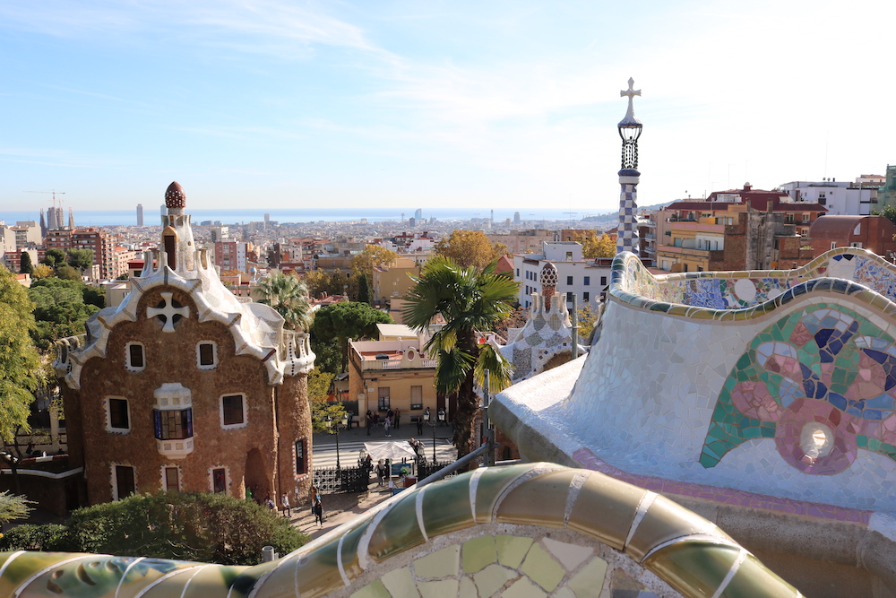 Photo of curvy chapel, towers, and railing in Parc Guell, Barcelona