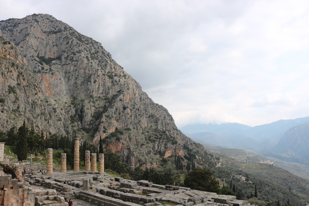 Photo of ruins at Delphi in front of a mountain