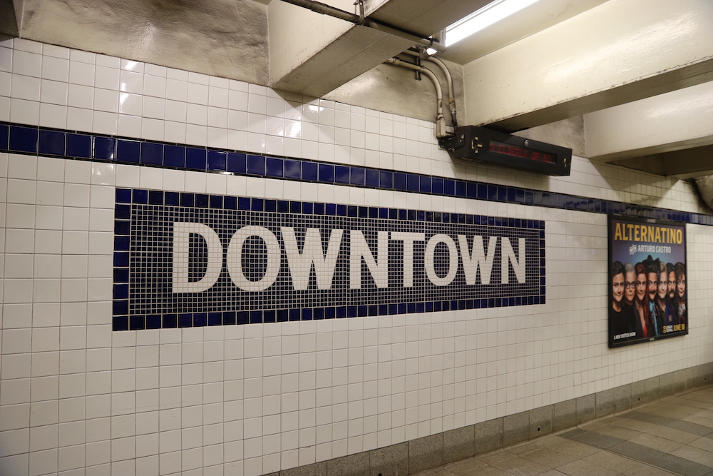 Subway mosaic indicating the entrance to the downtown platform in the NYC subway